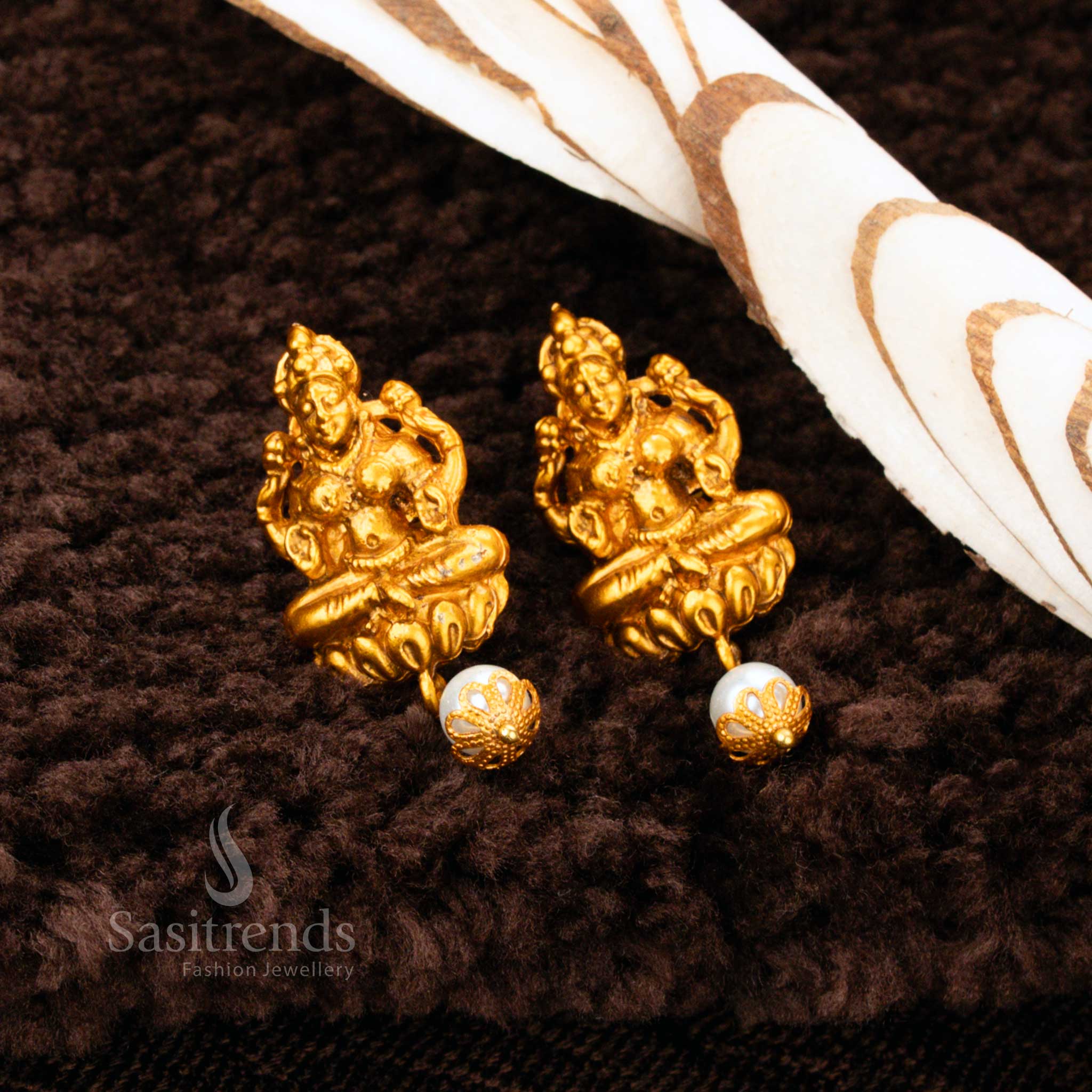Exquisite Matte Gold Plated Lakshmi Pearl Drop Earrings featuring detailed temple artistry – Ideal for bridal and festive saree looks – Sasitrends