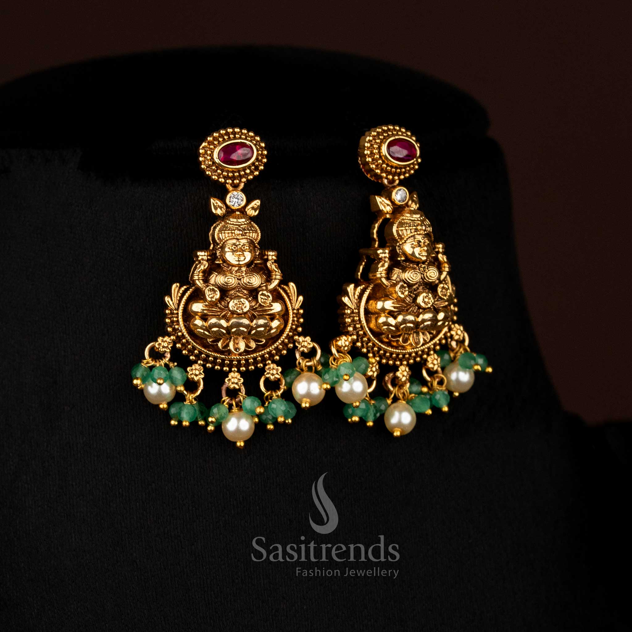 Harmonious ruby matte gold plated lotus Lakshmi Earringsadorned with pearl danglings, designed to wear for temple functions and festive family gatherings – Sasitrends