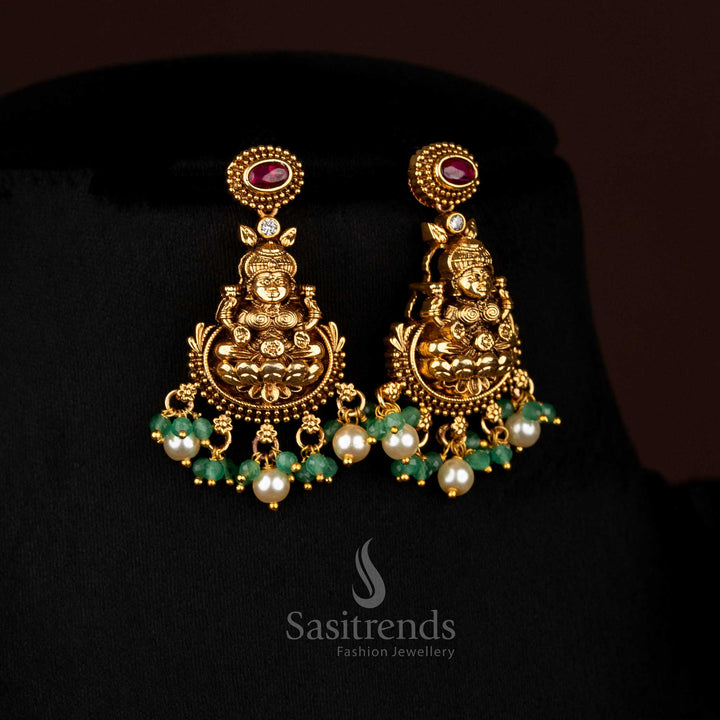 Harmonious ruby matte gold plated lotus Lakshmi Earringsadorned with pearl danglings, designed to wear for temple functions and festive family gatherings – Sasitrends
