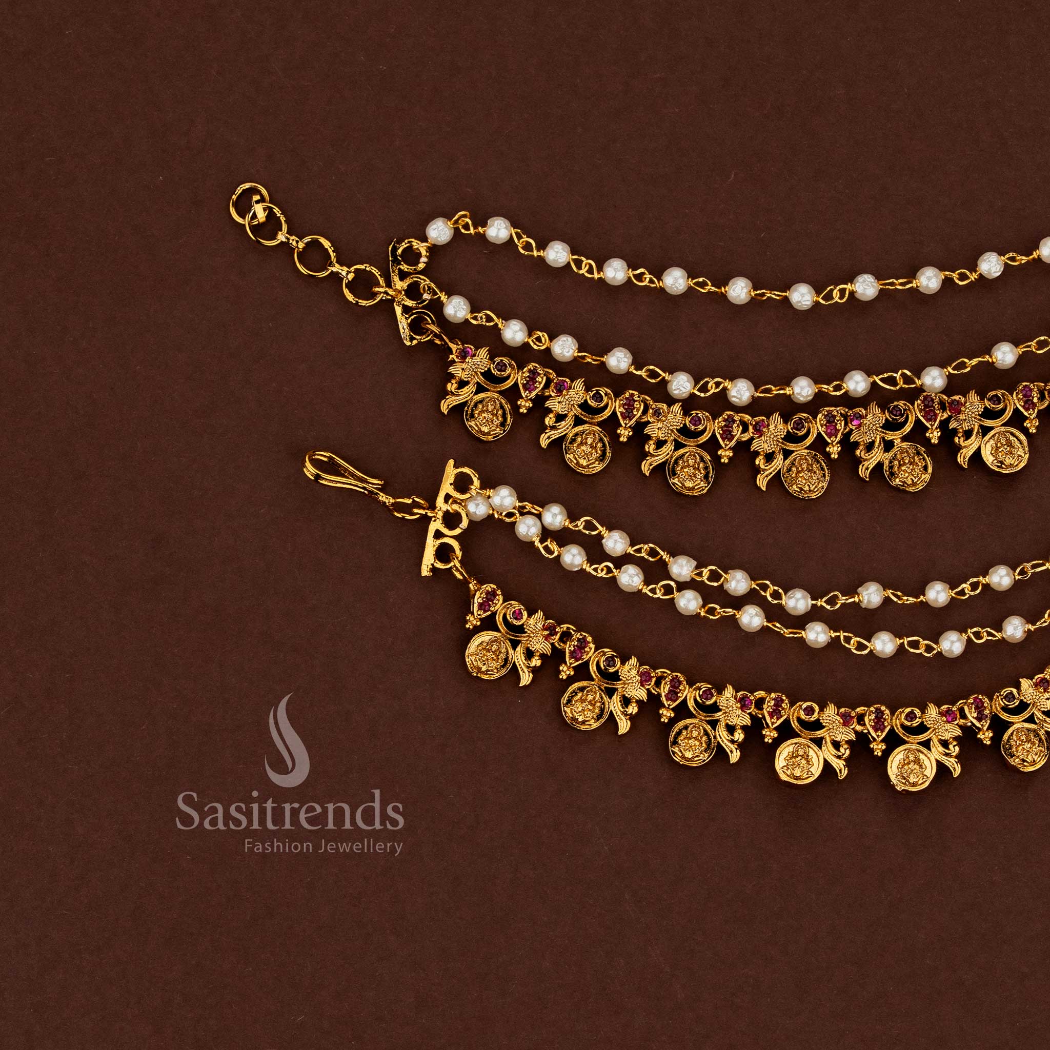 Lakshmi design temple matte gold plated American diamond matils enriched with deep ruby stones and pearl accents, crafted for bridal wedding splendour - Sasitrends