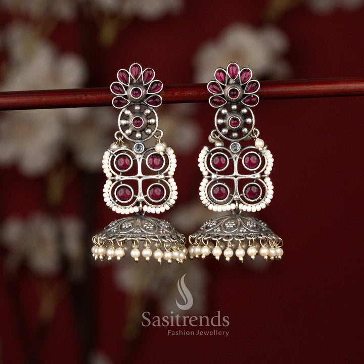 Majestic oxidised floral and geometric jhumka earrings with ruby stones and pearl bell drops ideal for sarees and festive wear – Sasitrends
