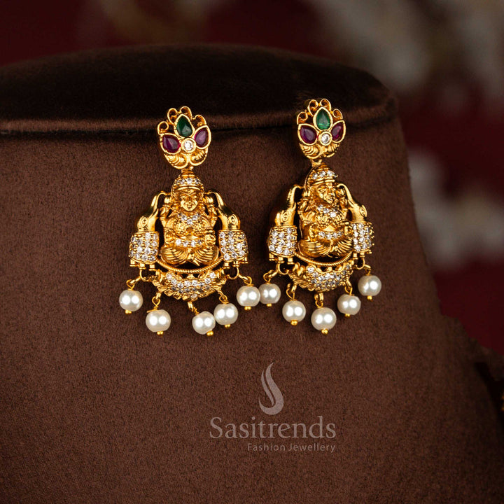 Celestial glow ear adornments shaped with Gajalakshmi figure and refined peacock embellishment highlighted by vibrant multi stones for festive gatherings – Sasitrends