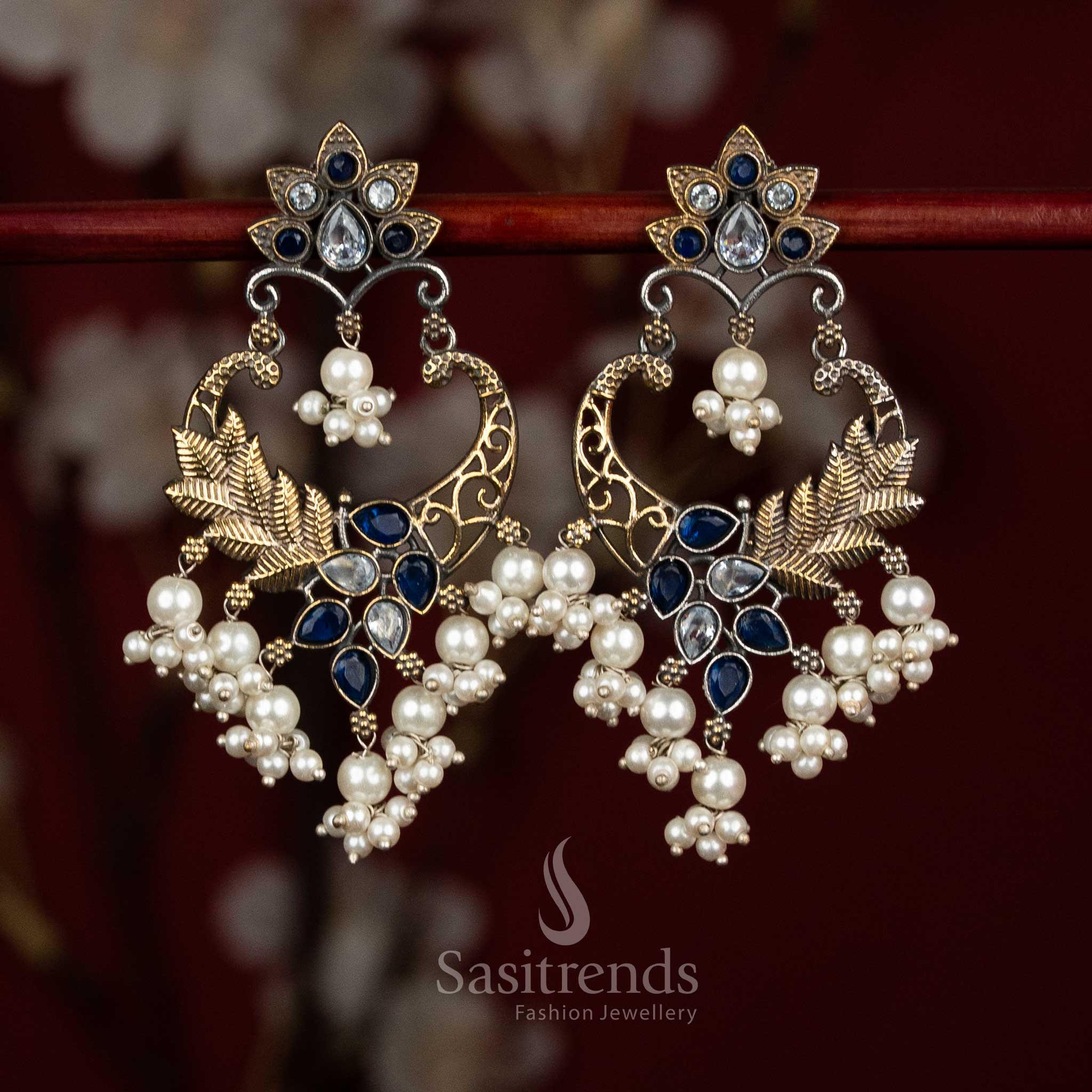 Antique oxidised 92.5 silver chandbali earrings featuring white and blue teardrop Monalisa stones, intricate mandala floral design, peacock arch filigree and clustered pearl drops for graceful ethnic styling - Sasitrends