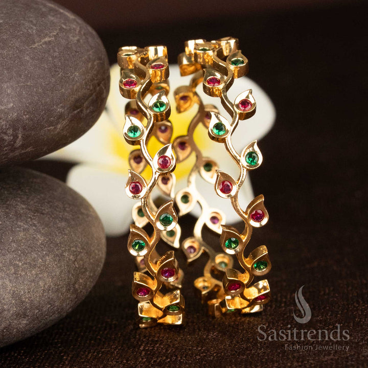 Opulent ruby green leaf motif bangles in micro gold plating with American diamond detailing for bridal elegance - Sasitrends