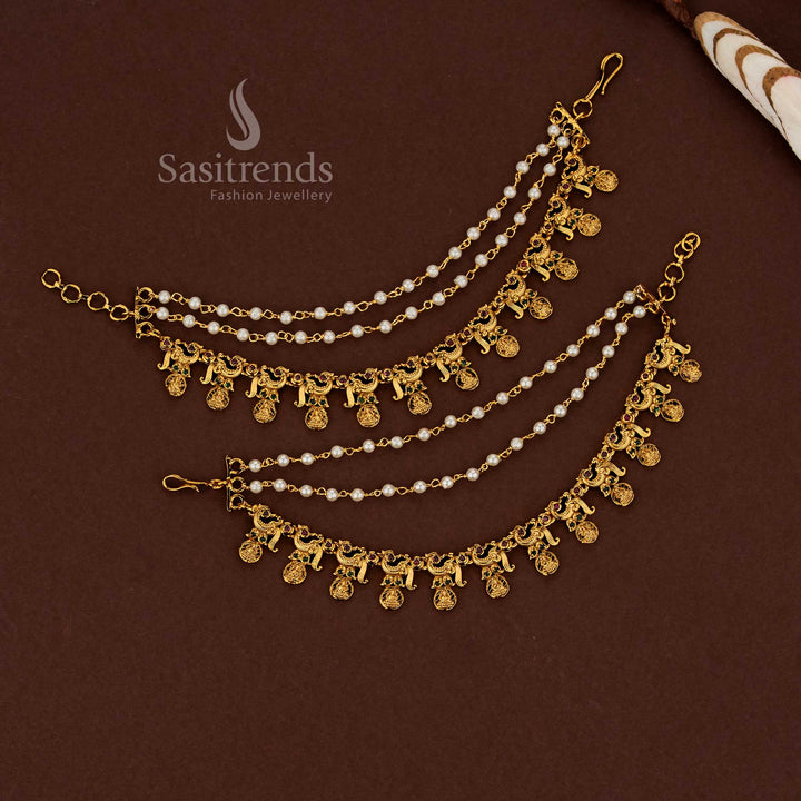 Ceremonial peacock Lakshmi temple matte gold plated American diamond matil ear chains featuring vibrant ruby-green stone harmony finished with luminous pearl detailing for bridal wear - Sasitrends