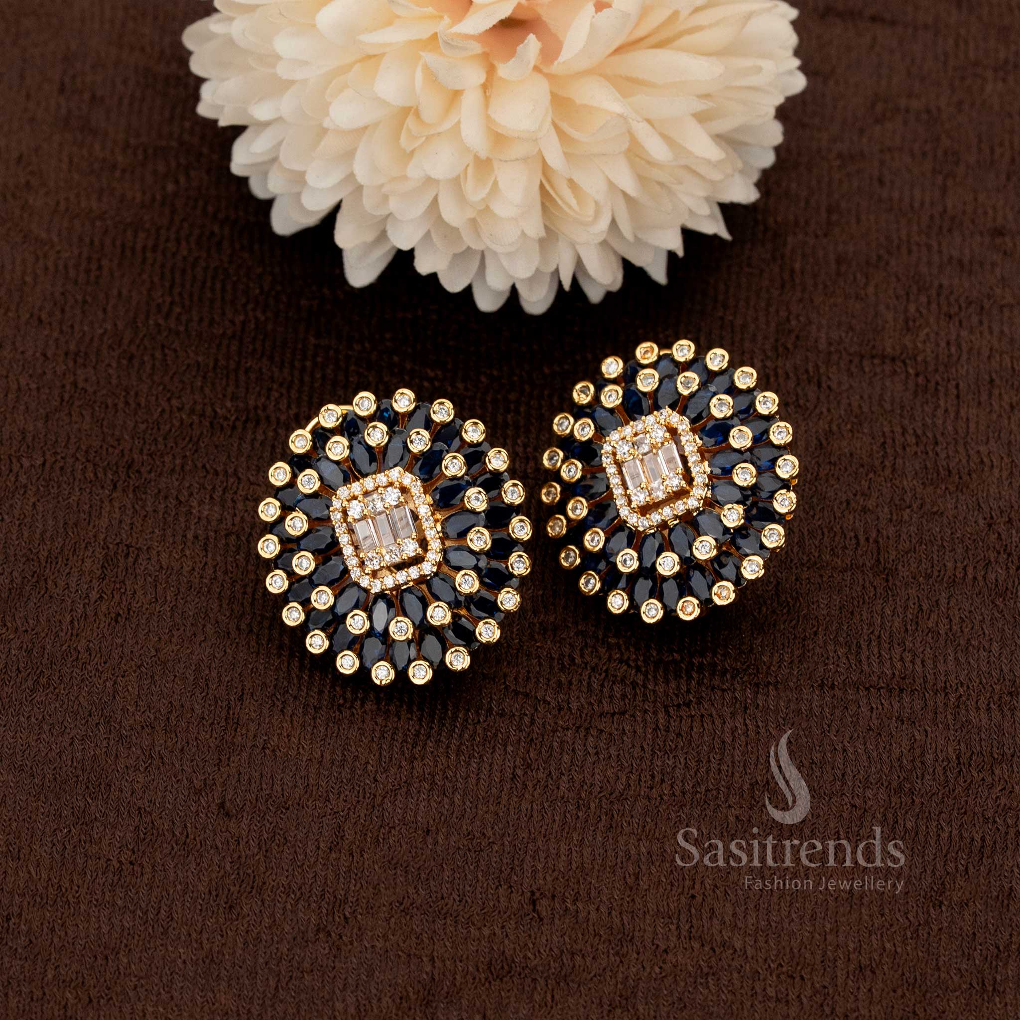 Blue gemstone floral studs with graceful gold plating and finely set American diamonds bringing a refreshing charm to evening wear – Sasitrends