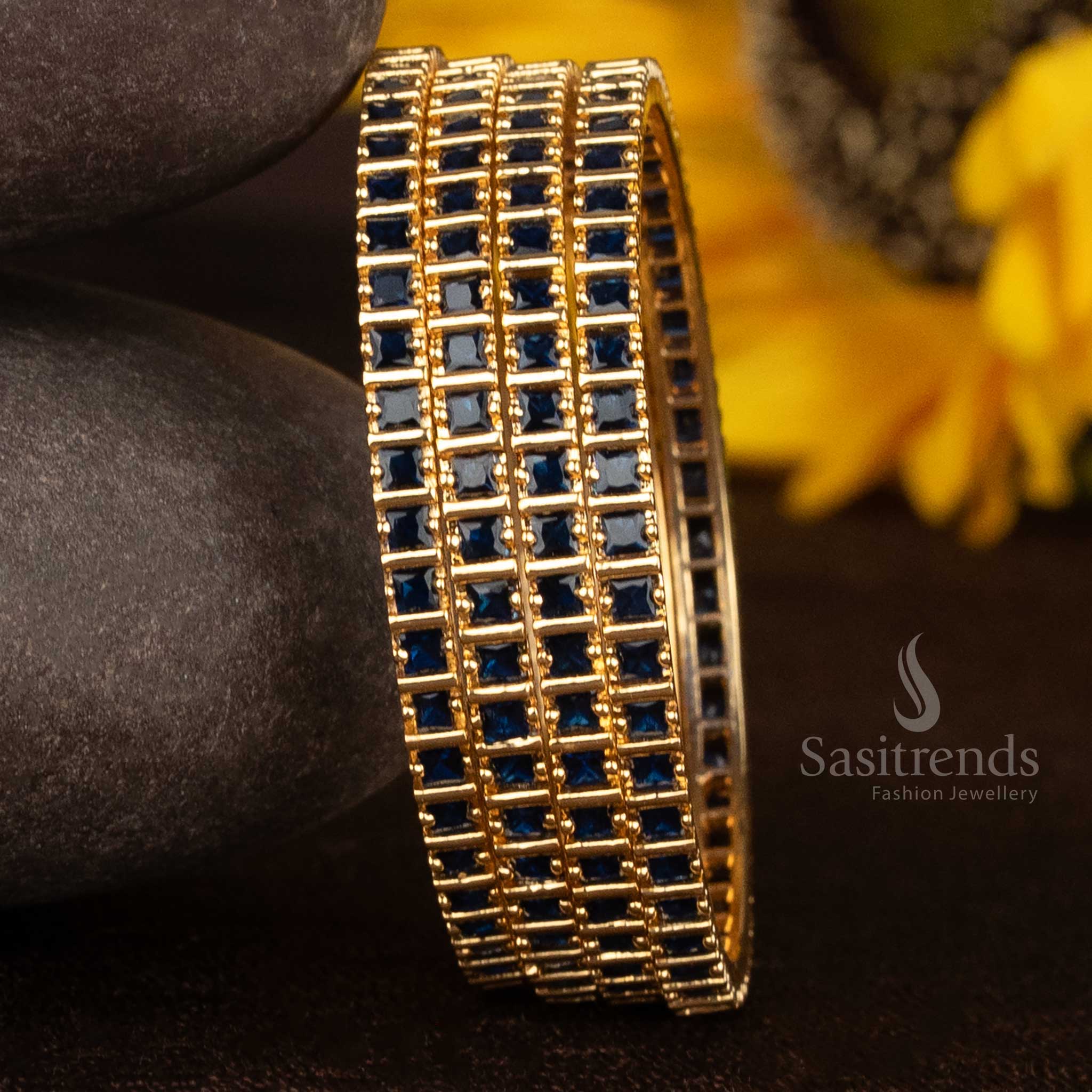 Stylish square bangles crafted in micro gold plating with radiant royal blue American diamond stones and artistic carved edges for ethnic sophistication – Sasitrends
