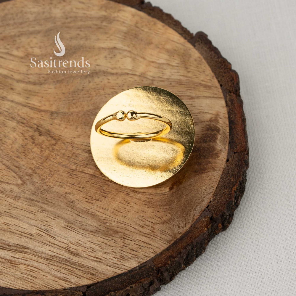 Minimalist gold plated textured flat disc ring highlighted with white seed pearl accent designed for comfortable everyday office fashion and subtle ethnic styling - Sasitrends