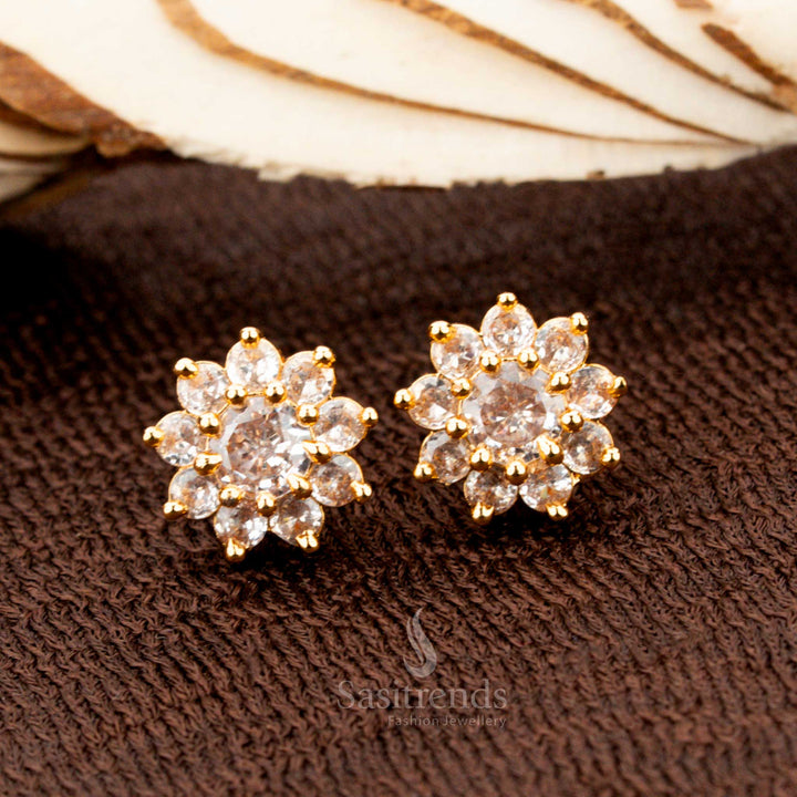 Timeless gold-plated flower stud earrings adorned with a sparkling white American diamond centre stone, a graceful accessory for weddings, ethnic outfits, and festive occasions - Sasitrends