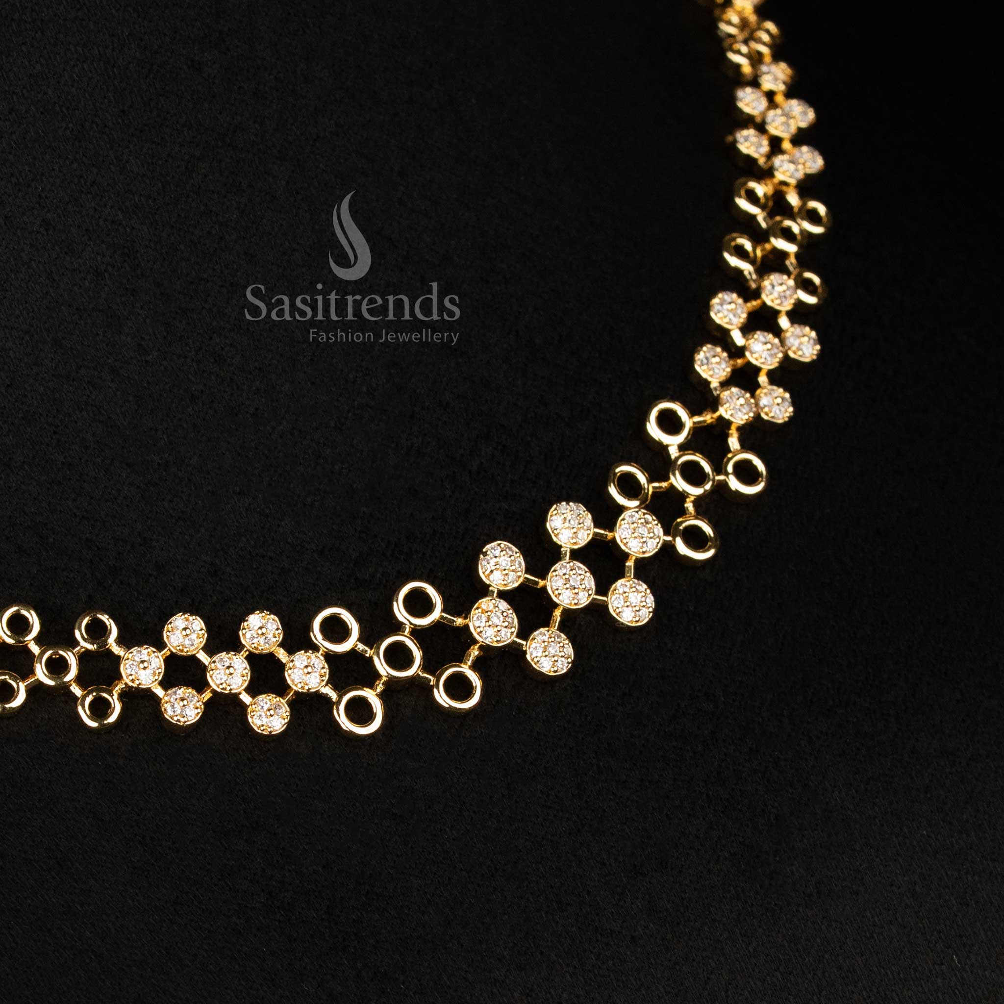 Contemporary Gold Toned American Diamond Jewellery Set With Sharp Geometric Link Shapes And A Radiant Sparkle – Ideal For Formal And Semi-Ethnic Looks – Sasitrends