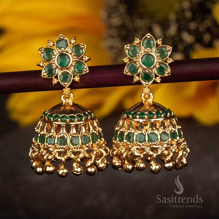 Regal green AD stone studded floral jhumka earrings in micro gold plated finish, decorated with pearl cluster hangings – ethnic festive jewellery ideal for traditional events – Sasitrends