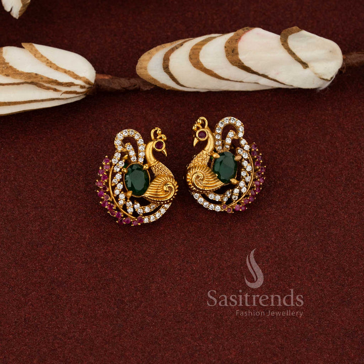 Classic temple matte gold plated AD peacock stud earrings suitable for ethnic wear traditional festive collection green - Sasitrends
