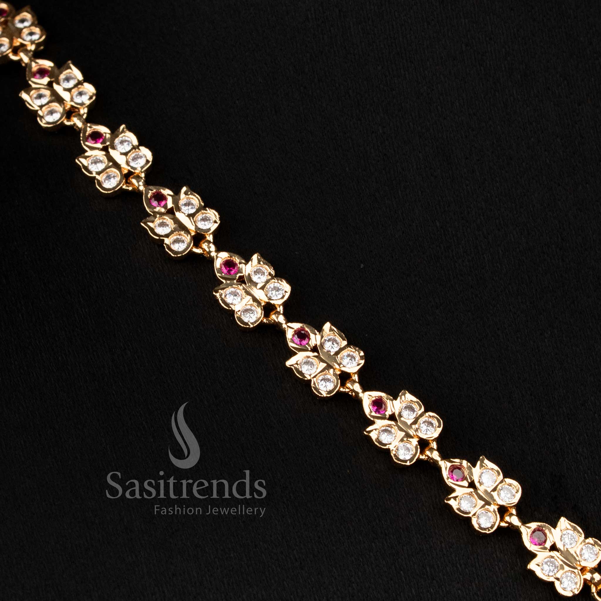Majestic white-ruby AD long necklace micro gold plated by Impon, featuring a designer pendant with suspended beads for festive parties – Sasitrends