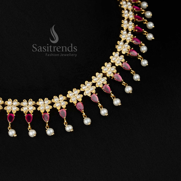 RadiantFlare micro gold plated pearl ruby 4 fringes floral teardrop AD necklace set styled with pearl drops for evening festivities - Sasitrends