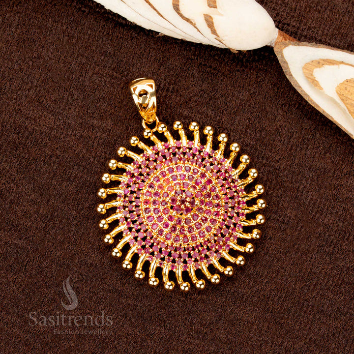 A gorgeous gold plated Chakara pendant featuring dazzling ruby stones, a timeless ethnic jewellery piece that exudes royalty