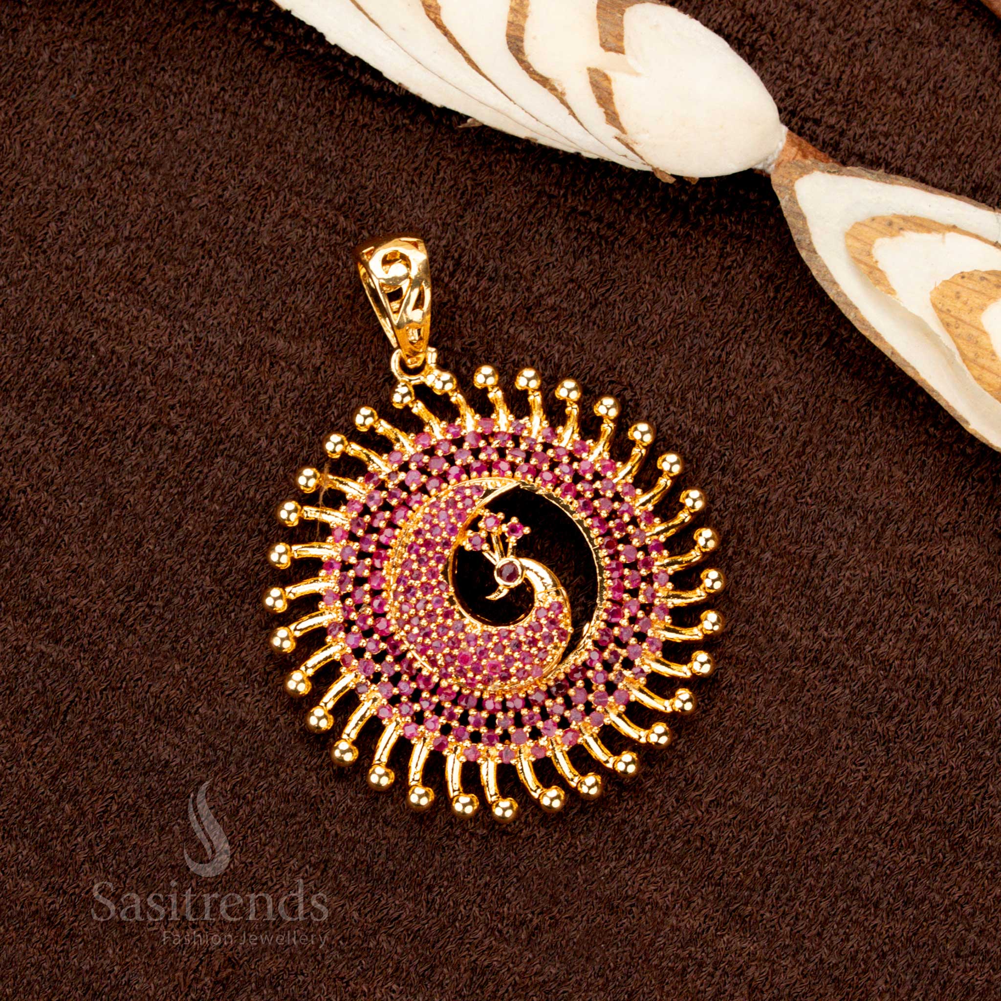Luxurious one-gram gold plated peacock pendant, beautifully crafted with deep ruby stones, a striking festive jewellery choice - Sasitrends