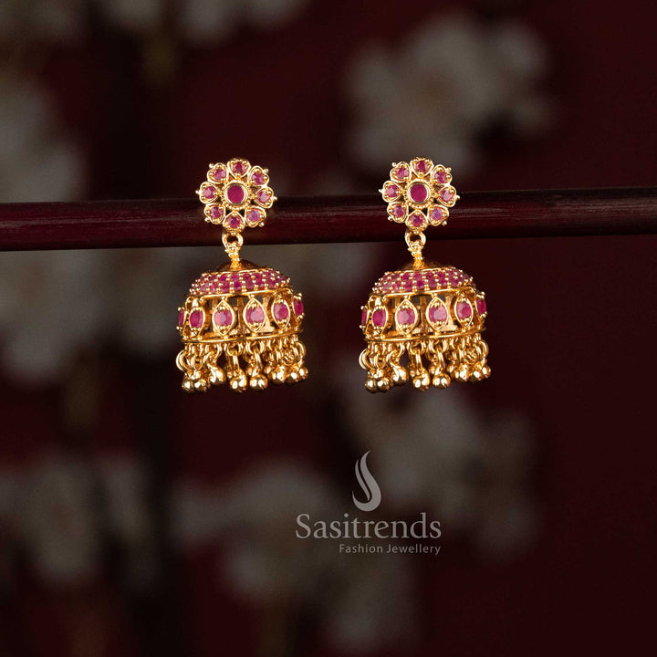 Attractive micro gold plated ruby AD stone studded flower pattern jhumka earrings for women, designed for festive ethnic elegance and traditional wear – Sasitrends