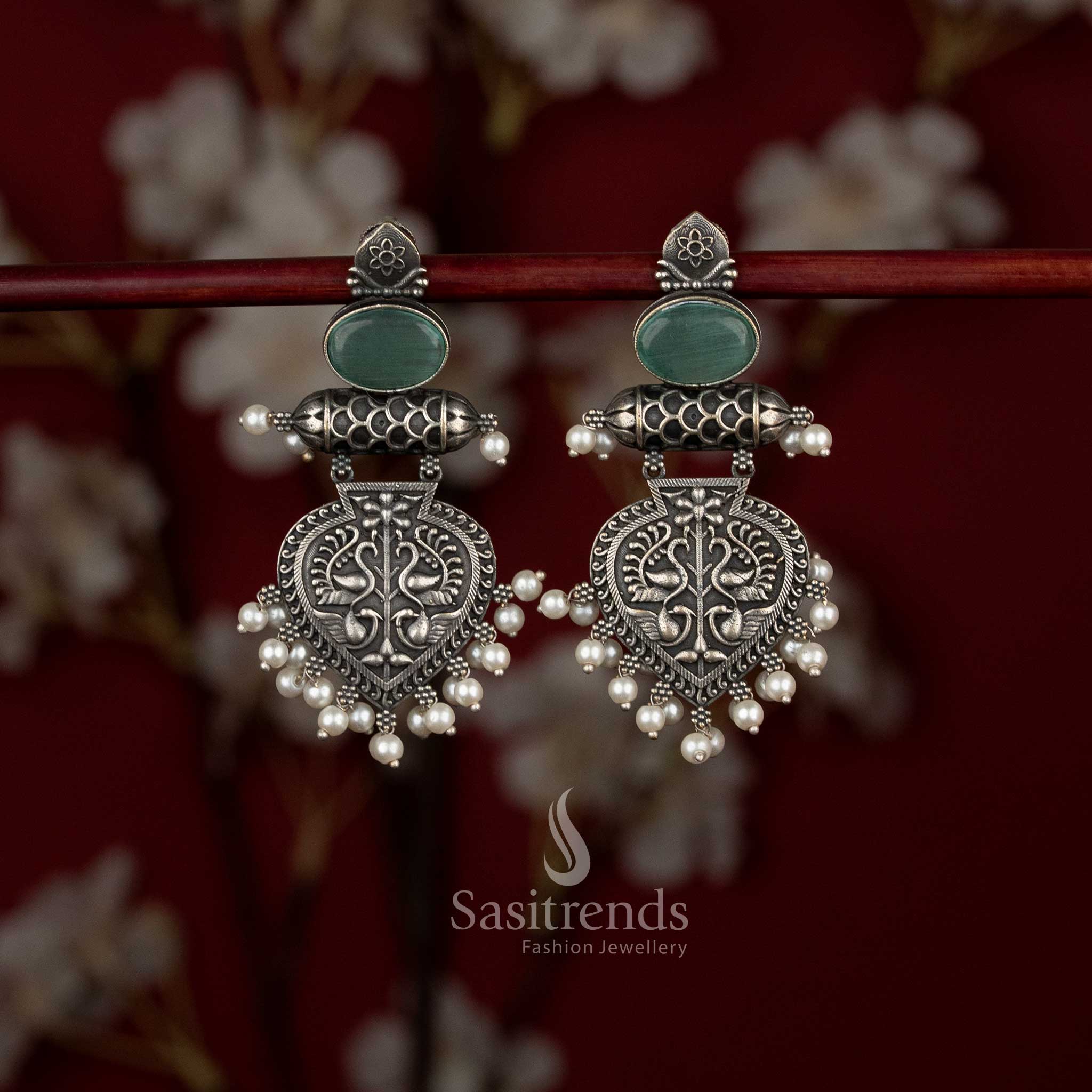 Regal oxidised German silver mint temple-inspired layered drop earrings with shield engravings and pearl cluster adornment – Sasitrends