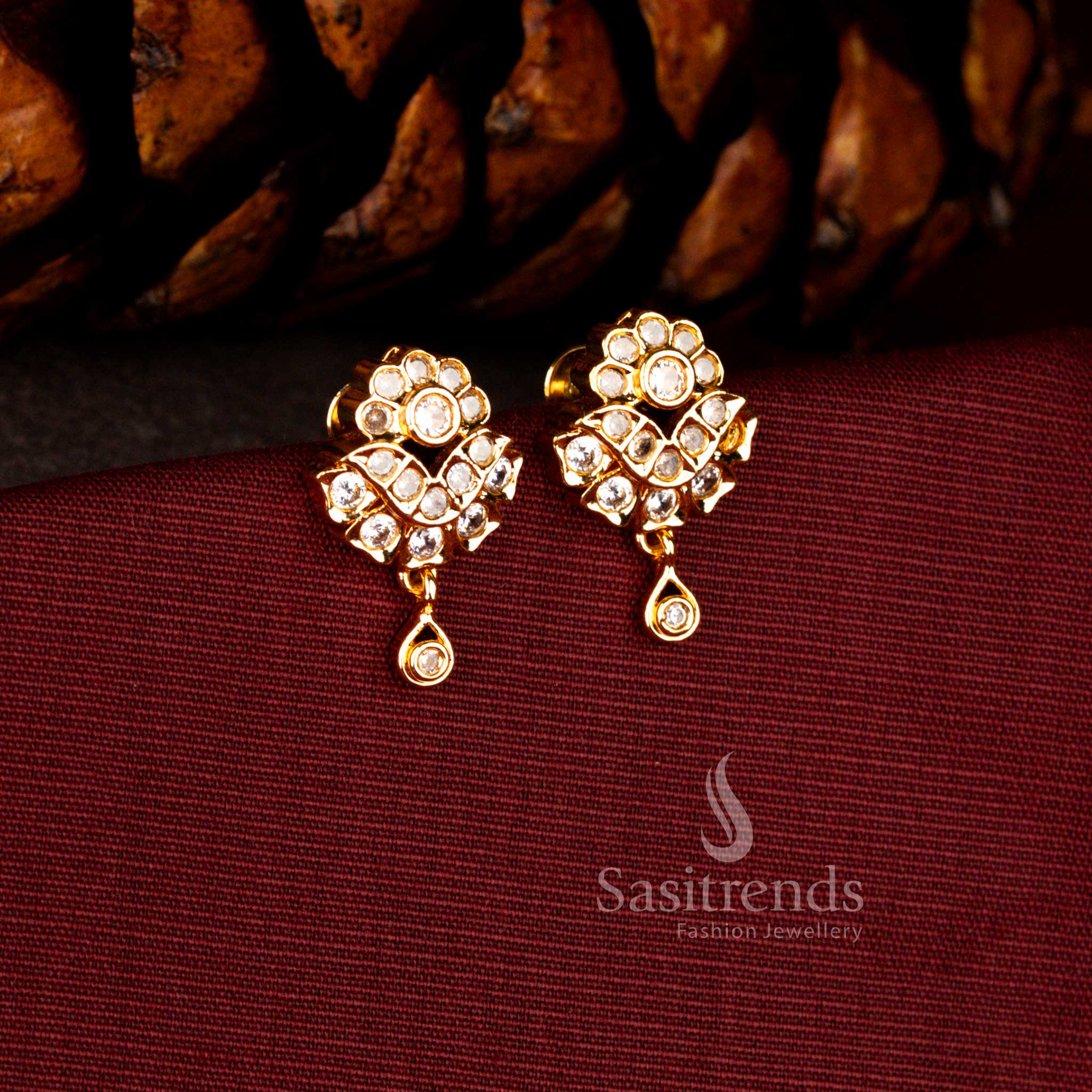 Classic one gram earrings in white showcasing floral AD artistry and polished teardrop dangle for timeless festive styling – Sasitrends