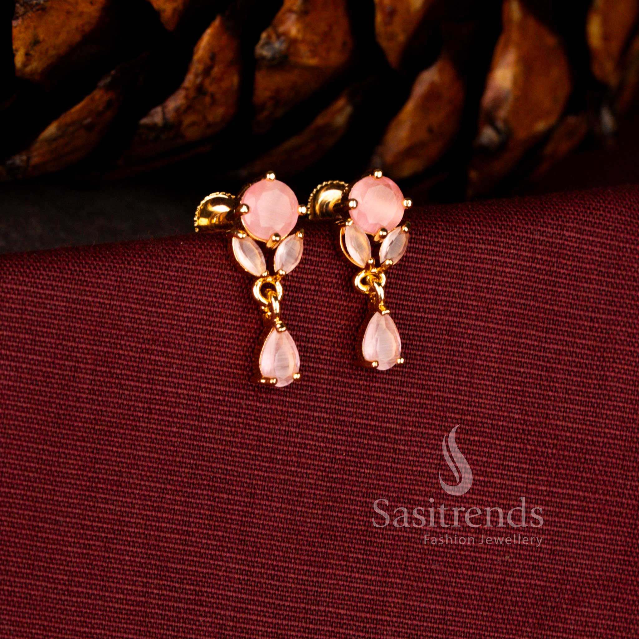 Grand 24K gold plated earrings in pink showcasing floral AD cluster and luminous brilliant teardrop styling – Sasitrends