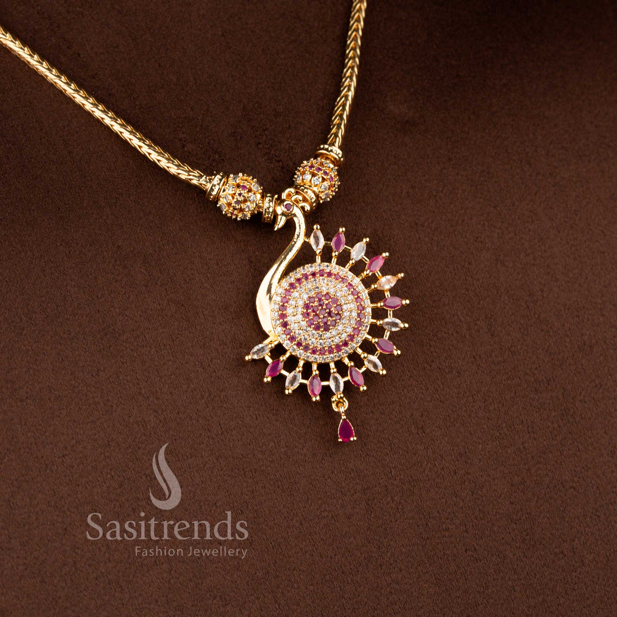 Vibrant micro gold plated peacock necklace in white-ruby shades featuring sparkling stones and delicate pearl drops, one gram jewellery – Sasitrends