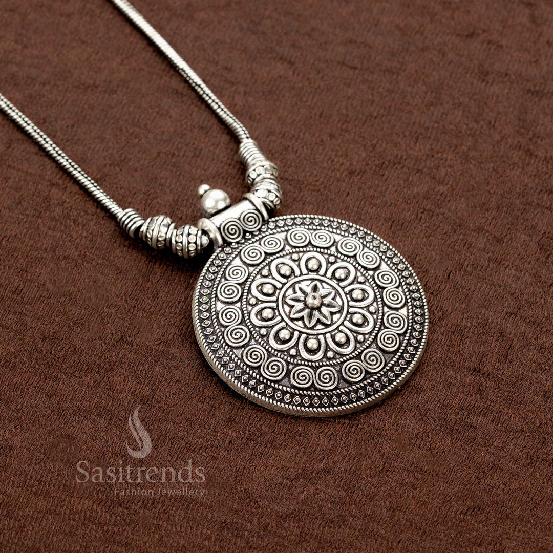 Oxidised silver round pendant necklace with spiral and floral designs by Sasitrends