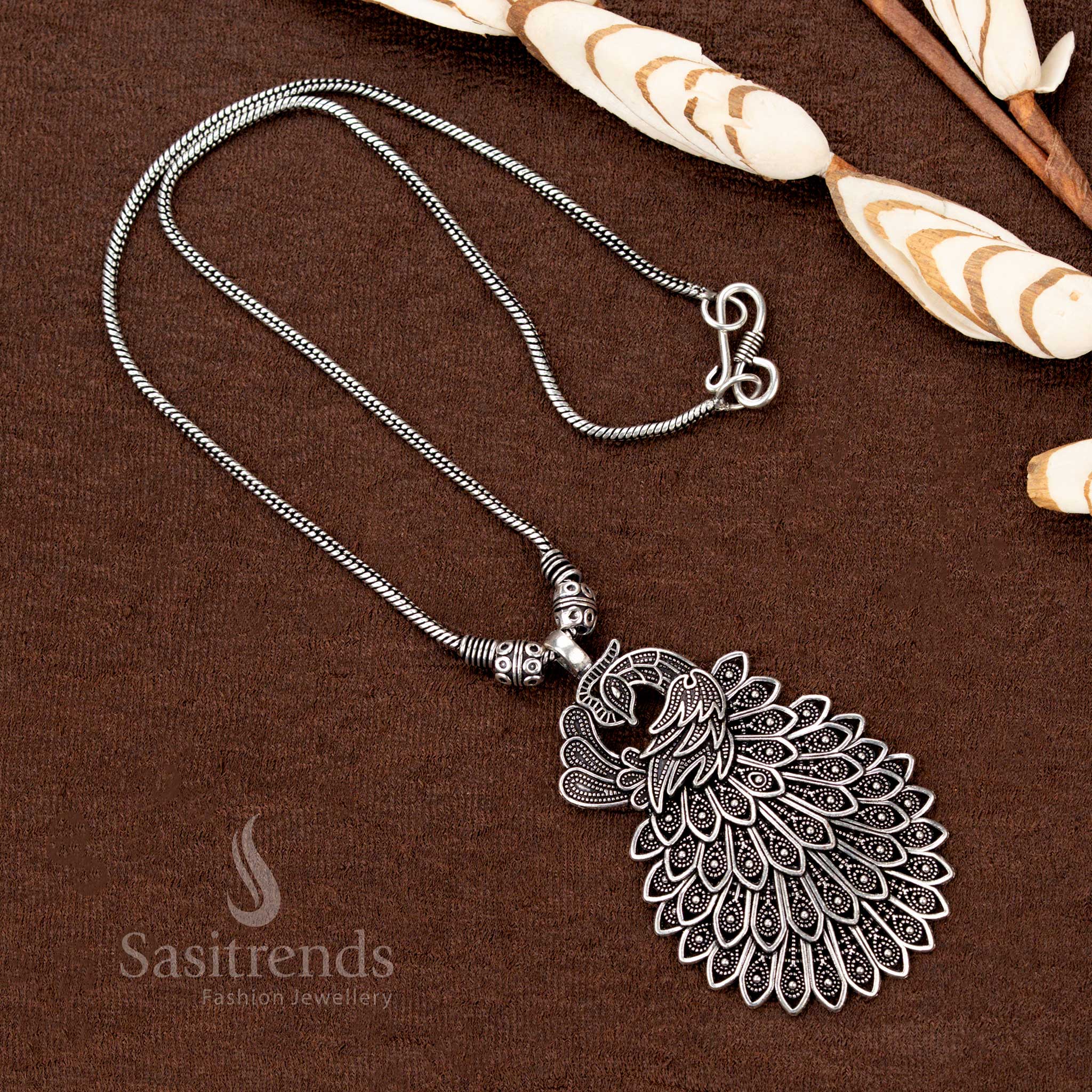Antique tribal oxidised necklace featuring engraved peacock design – Sasitrends