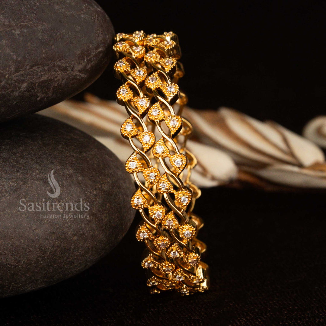 Leafy motif micro gold plated bangles featuring white American diamond stones with a 1-year guarantee – a timeless traditional jewellery creation for classic Indian styling by Sasitrends
