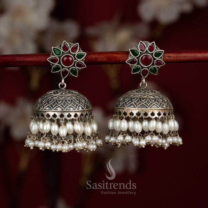 Jade garnet heritage oxidised silver ruby green dome jhumkas with intricate floral stone design and pearl cascades for party elegance - jewellery - Sasitrends