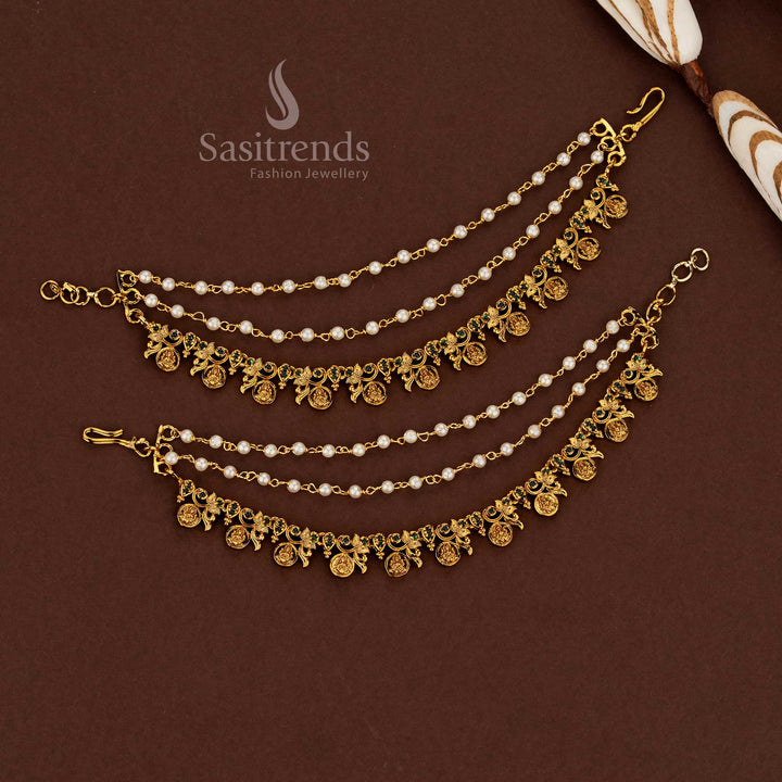 Sacred Lakshmi motif temple matte gold plated American diamond matil ear chains adorned with lush green stones and pearl detailing for wedding ceremonies - Sasitrends