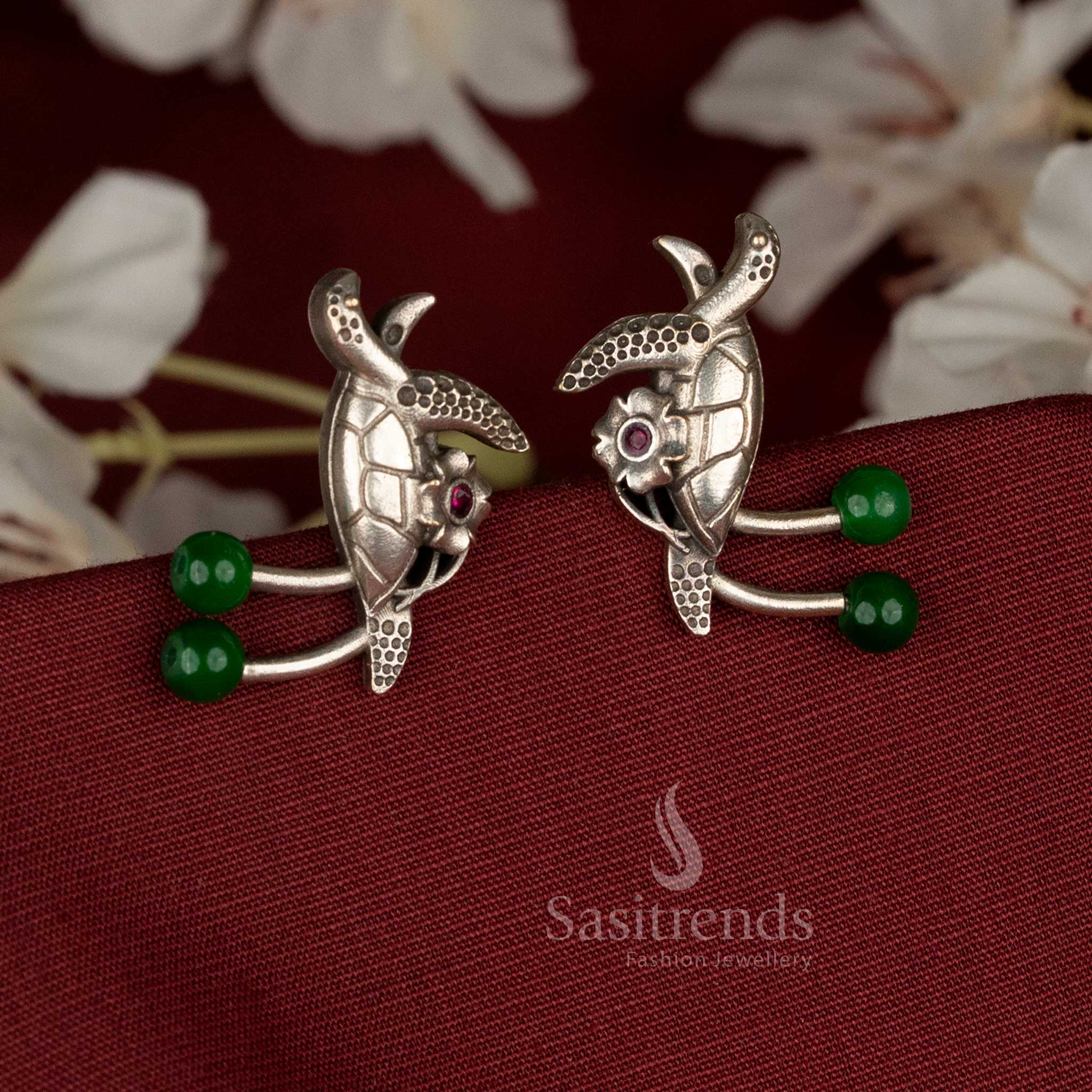 Lush oxidised German silver turtle earrings featuring green pearls and sparkling stones, designed for casual, office, and ethnic occasions – Sasitrends