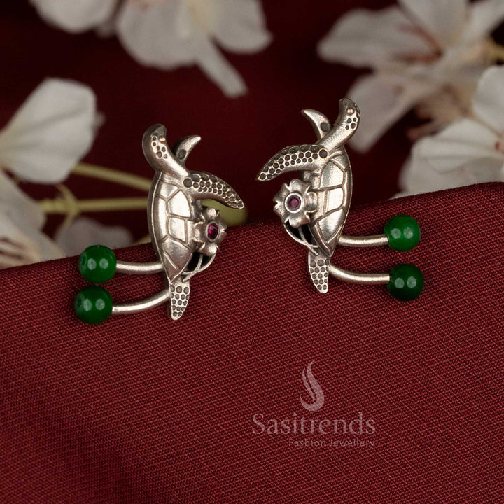 Lush oxidised German silver turtle earrings featuring green pearls and sparkling stones, designed for casual, office, and ethnic occasions – Sasitrends