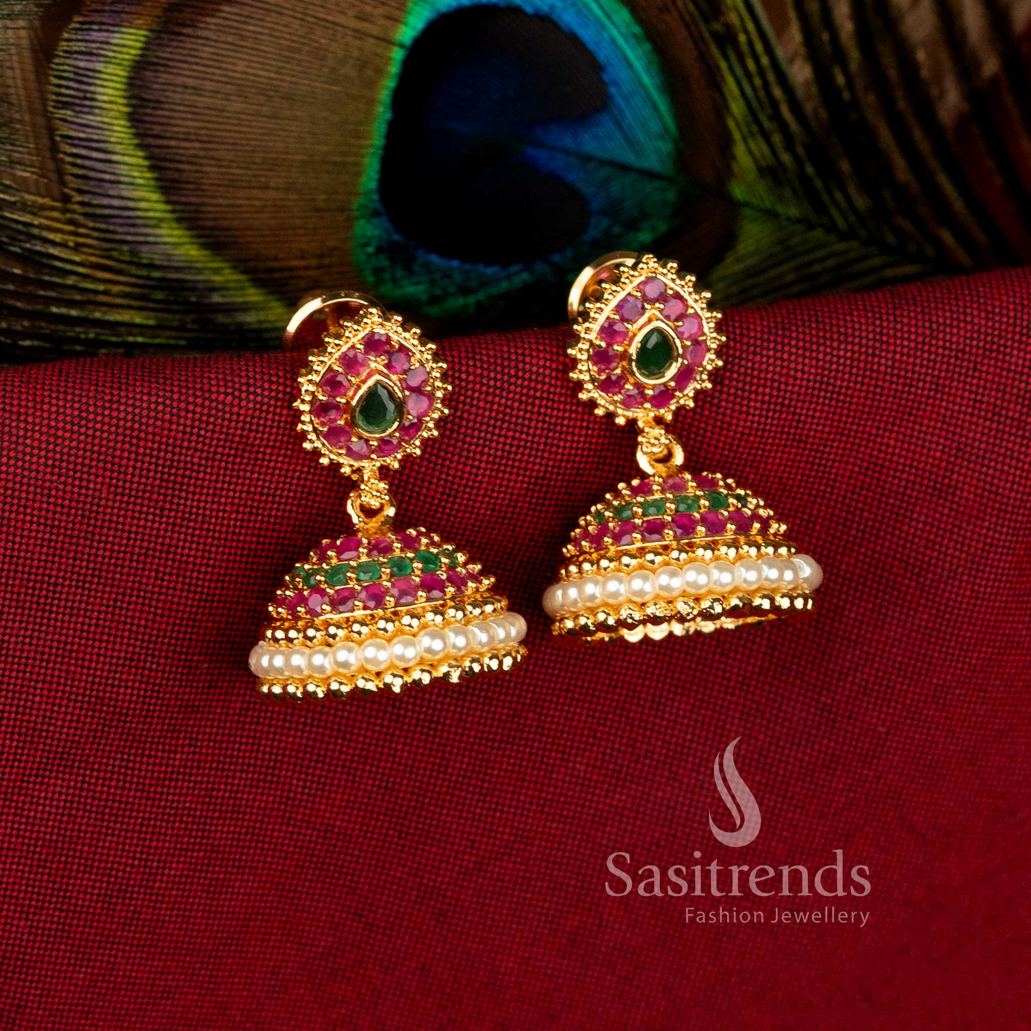 Festive gleam ruby-green micro gold plated teardrop jhumka earrings with pearl dome and American diamonds for celebratory wear – Sasitrends