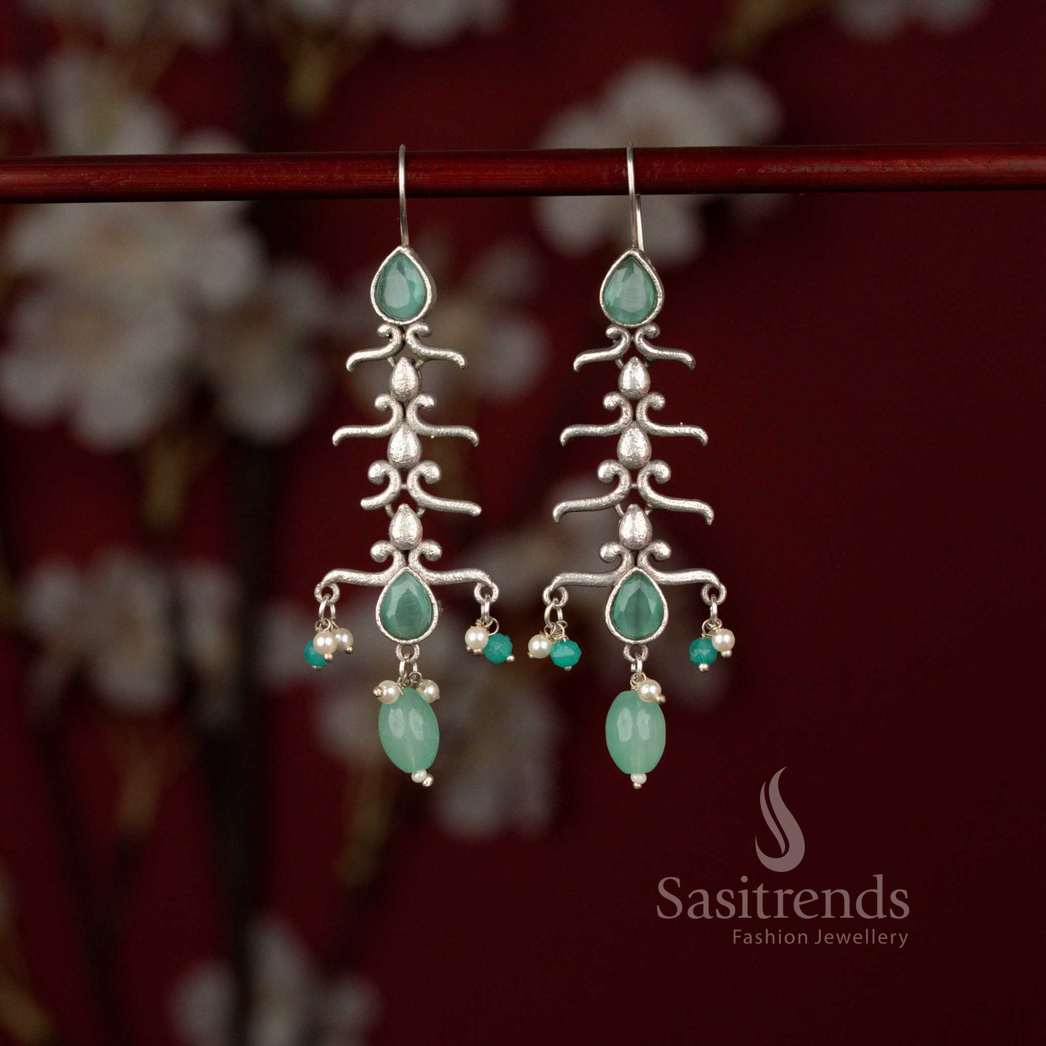 Graceful oxidised statement earrings featuring nature inspired branch curves, mint stones and pearl hangings perfect for sarees and celebrations – Sasitrends
