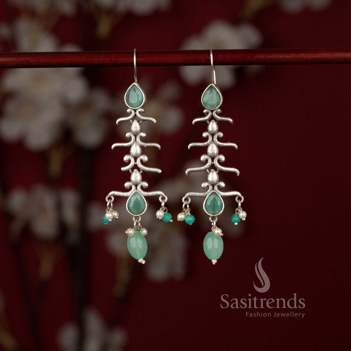 Graceful oxidised statement earrings featuring nature inspired branch curves, mint stones and pearl hangings perfect for sarees and celebrations – Sasitrends