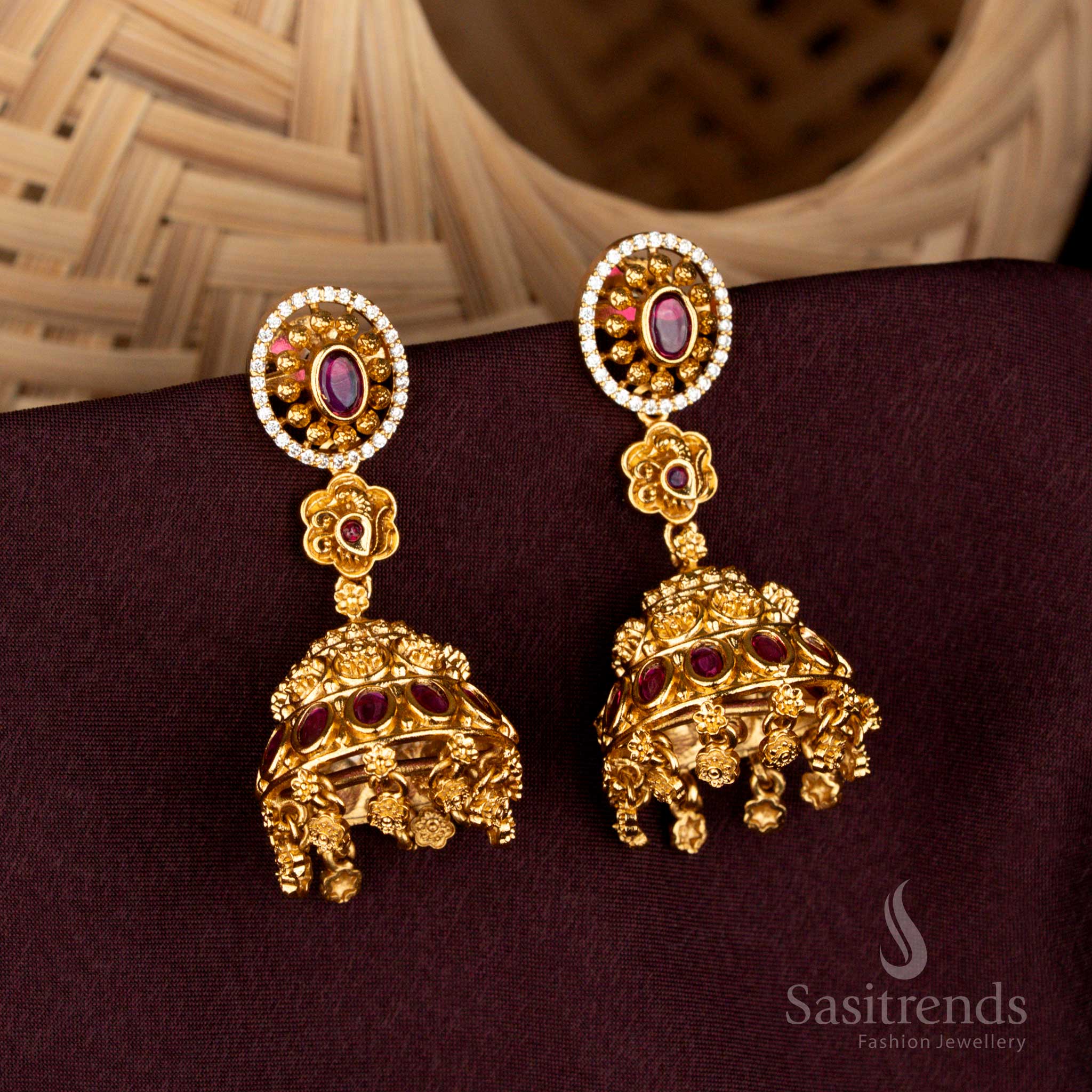 Illustrious white ruby oval-in-circle temple jhumka earrings featuring radiant floral domes, baroque danglers, grandiose matte gold detailing, and sacred bridal artistry – Sasitrends