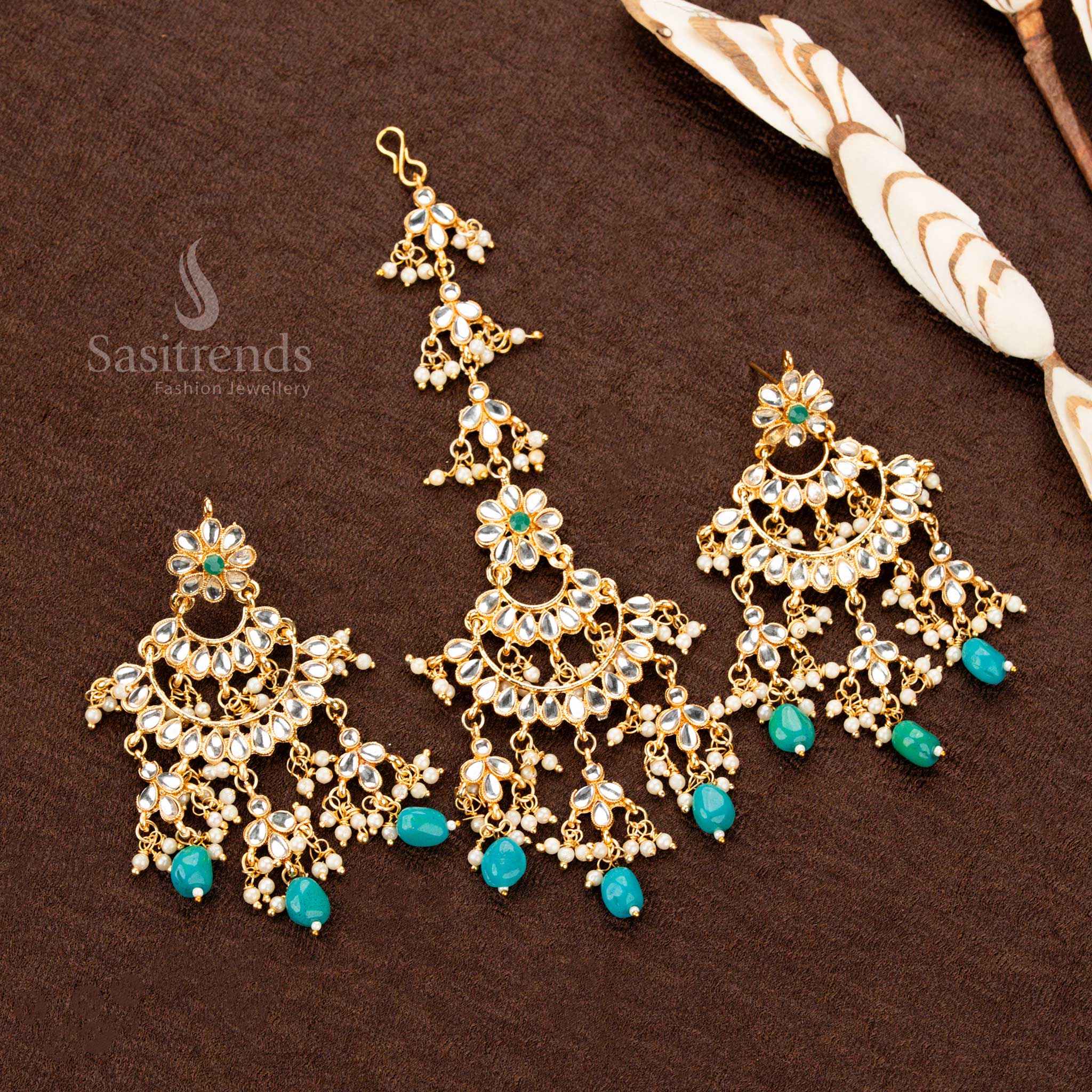 Royal green antique gold plated tikka and earrings, featuring an ornate crescent design with filigree details and delicate pearl highlights, embodying the essence of heritage bridal elegance - Sasitrends