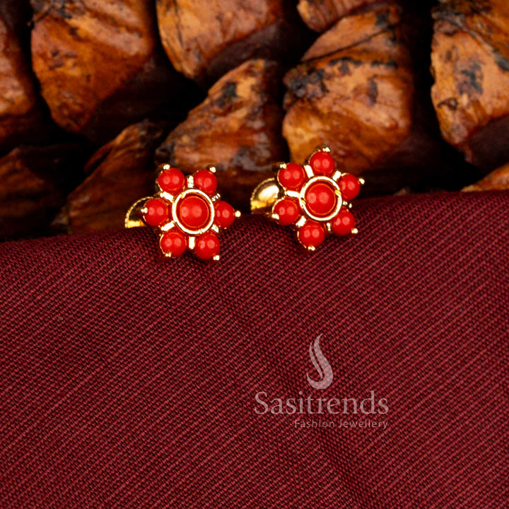 Traditional micro gold plated floral stud earrings enriched with pearl accents and pavalam colour styling suitable for temple ceremonies – Sasitrends