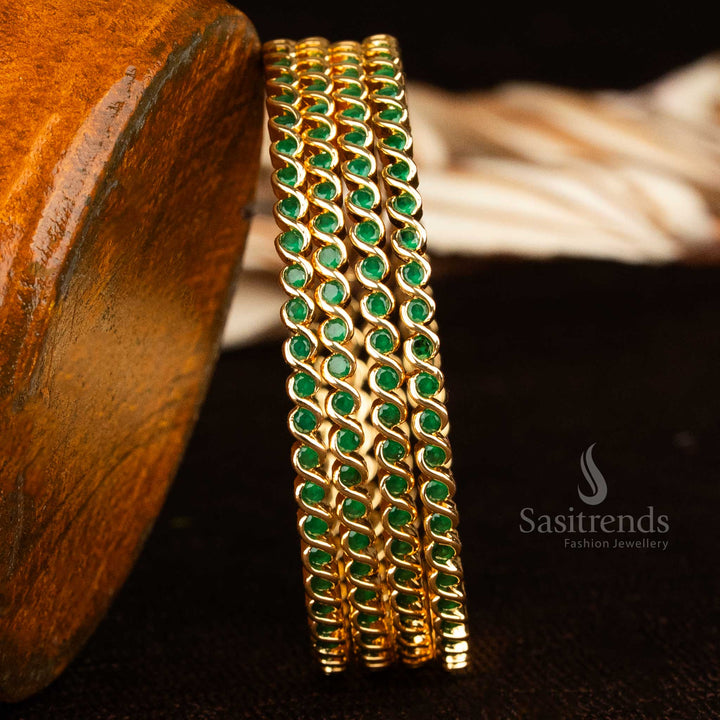 Vibrant green spiral pattern bangles in micro gold plating with Kemp-style AD stones, radiating glamorous temple jewellery vibes for ethnic occasions – sasitrends