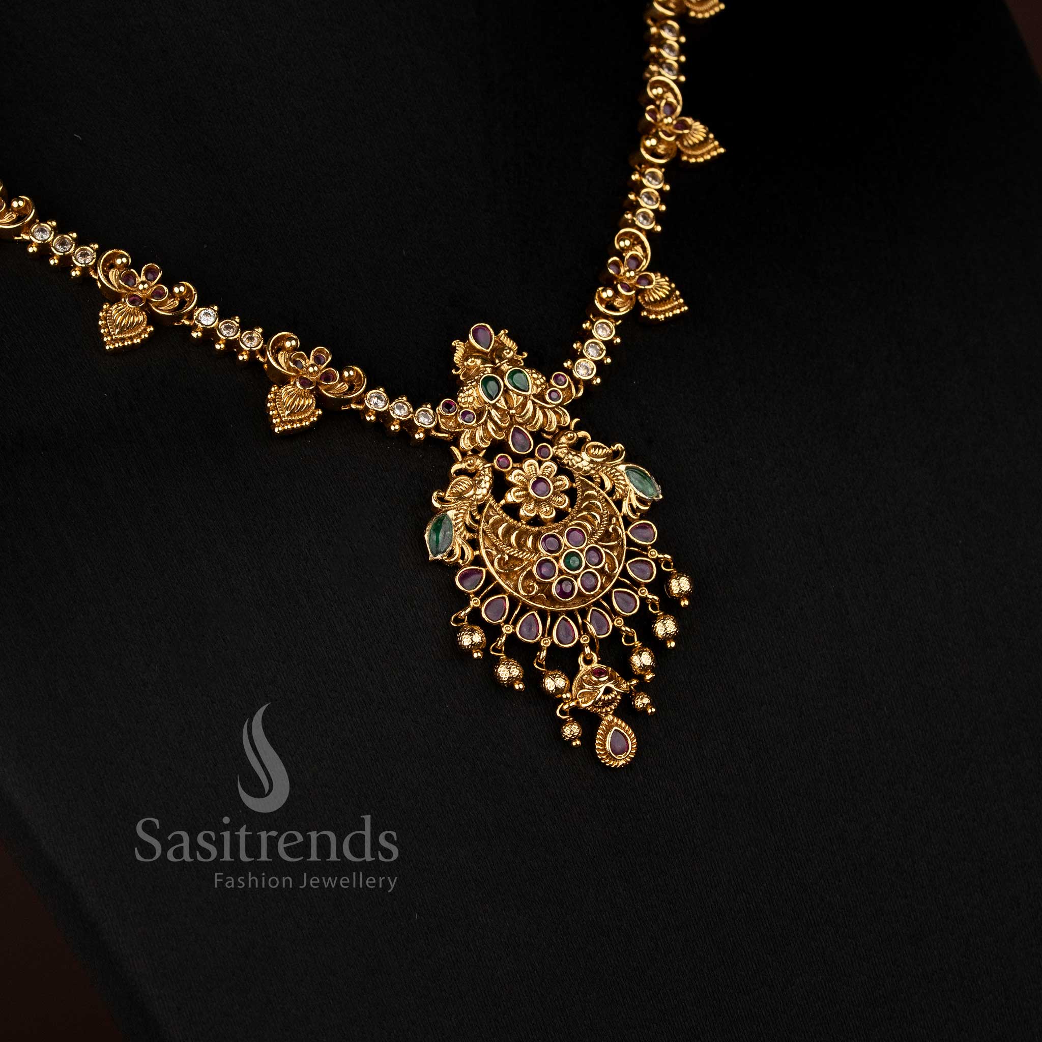 Majestic Matte Gold Plated AD Peacock and Floral Necklace with Teardrop Detailing, Perfect for Traditional Festive and Bridal Jewellery Wear – Sasitrends