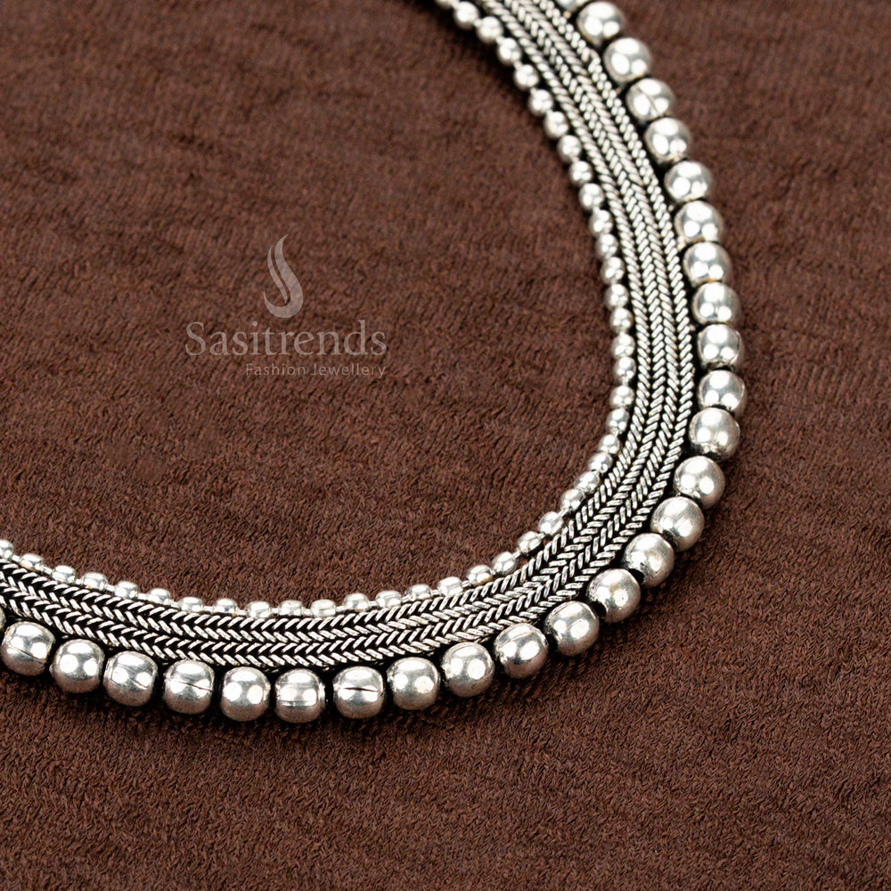 Temple-inspired oxidised German silver dual-chain choker necklace with classic ball embellishments and artisanal aesthetics, ideal for Navaratri, Indian weddings - Sasitrends