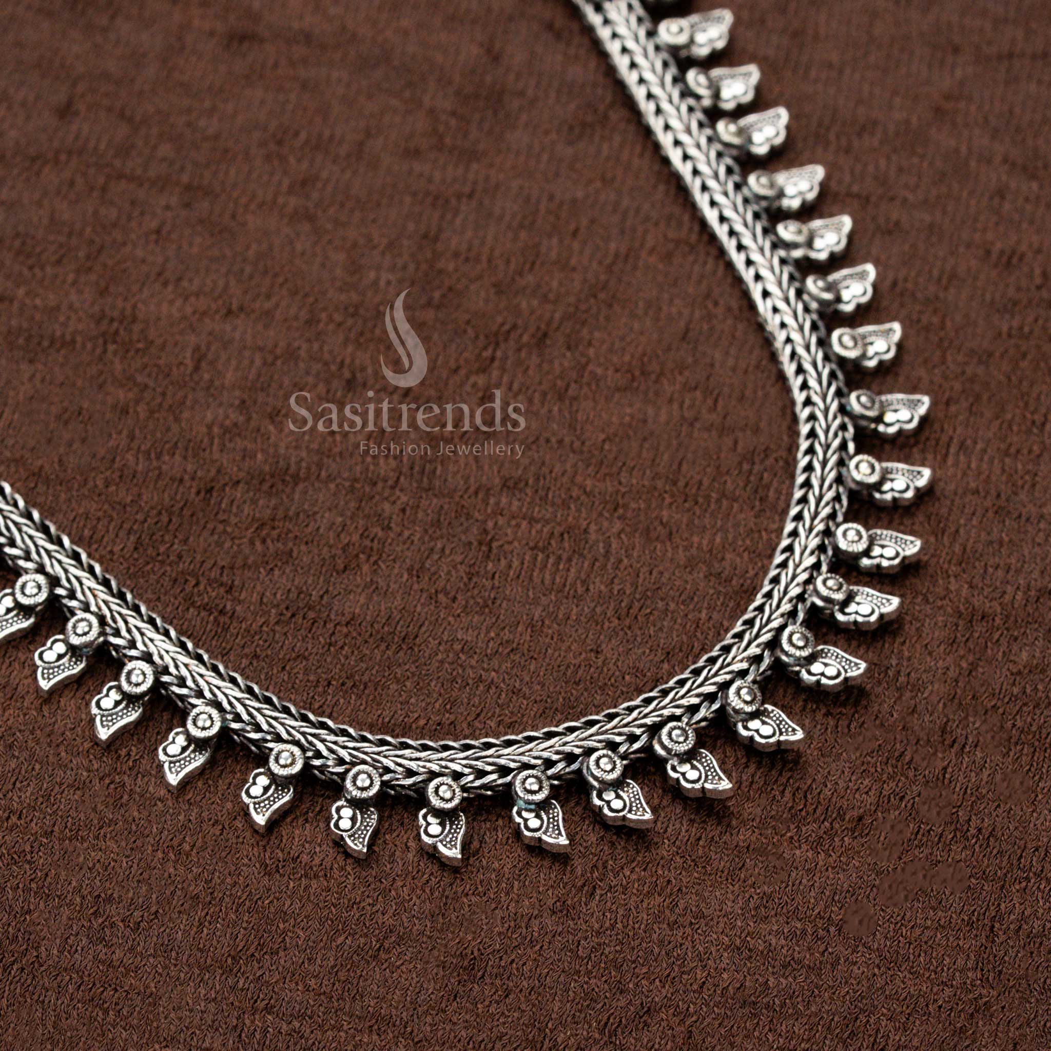 Handcrafted oxidised German silver necklace with intricately detailed tribal-inspired arrow charms, a rustic oxidised sheen, and a bold boho vibe—an ideal statement piece for sarees and cultural celebrations - Sasitrends