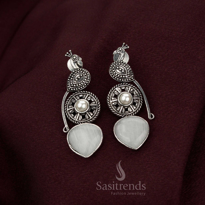Illustrious white oxidised peacock earrings adorned with graceful pearl drops designed for celestial heritage occasions noble elegance and resplendent jewellery style – Sasitrends