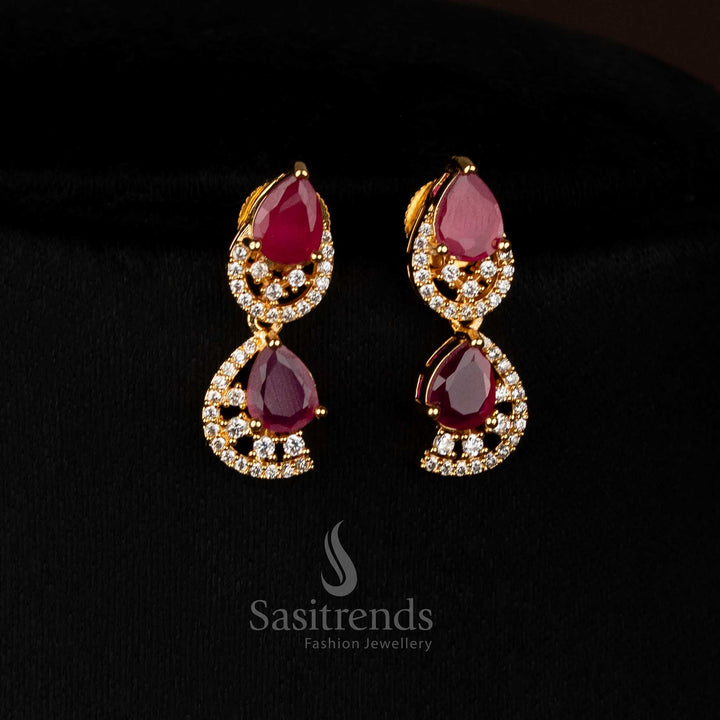 Radiant ruby gold plated teardrop loop earrings with sparkling AD stones for luxury parties - Sasitrends