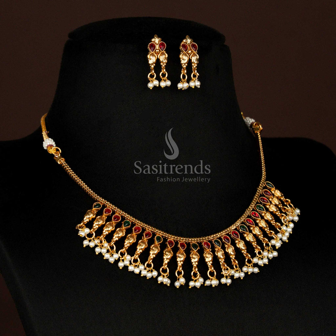 Royal matte gold plated ruby-green floral drop necklace set with hanging pearl beads and temple-style textured chain – grand ethnic jewellery for traditional sarees and festive occasions – Sasitrends