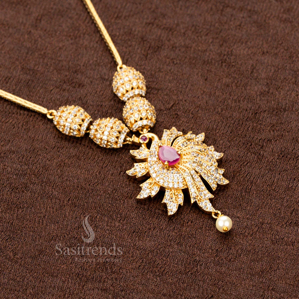 Antique-style trendy matte gold plated jewellery set featuring a stunning peacock pendant with ruby embellishments, an ideal adornment for ethnic festivals - Sasitrends