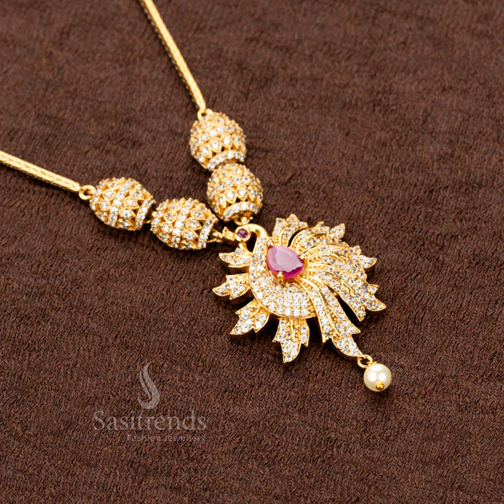 Antique-style trendy matte gold plated jewellery set featuring a stunning peacock pendant with ruby embellishments, an ideal adornment for ethnic festivals - Sasitrends