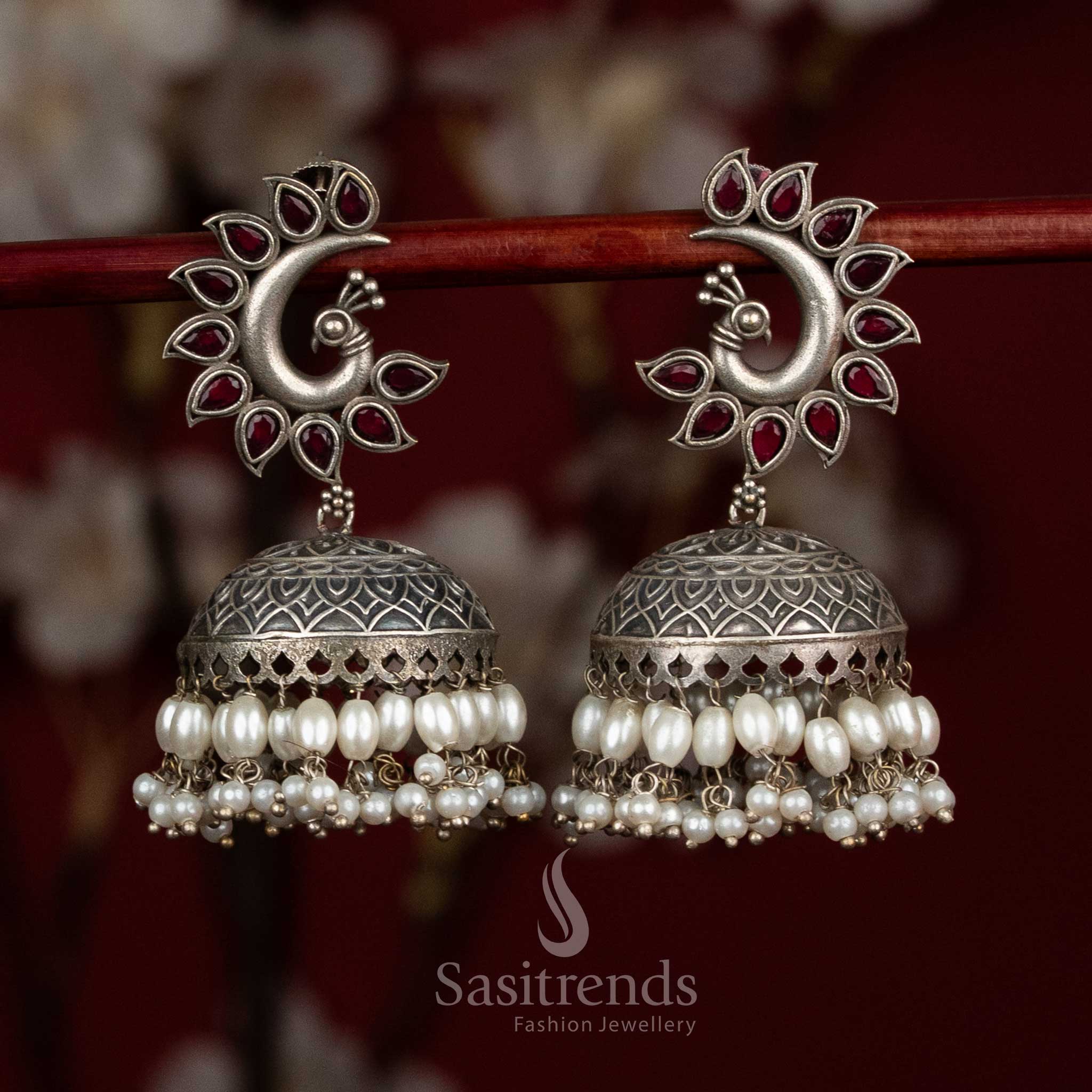 Radiance oxidised 92.5 silver ruby peacock motif dome jhumkas with layered pearls for party - jewellery - Sasitrends