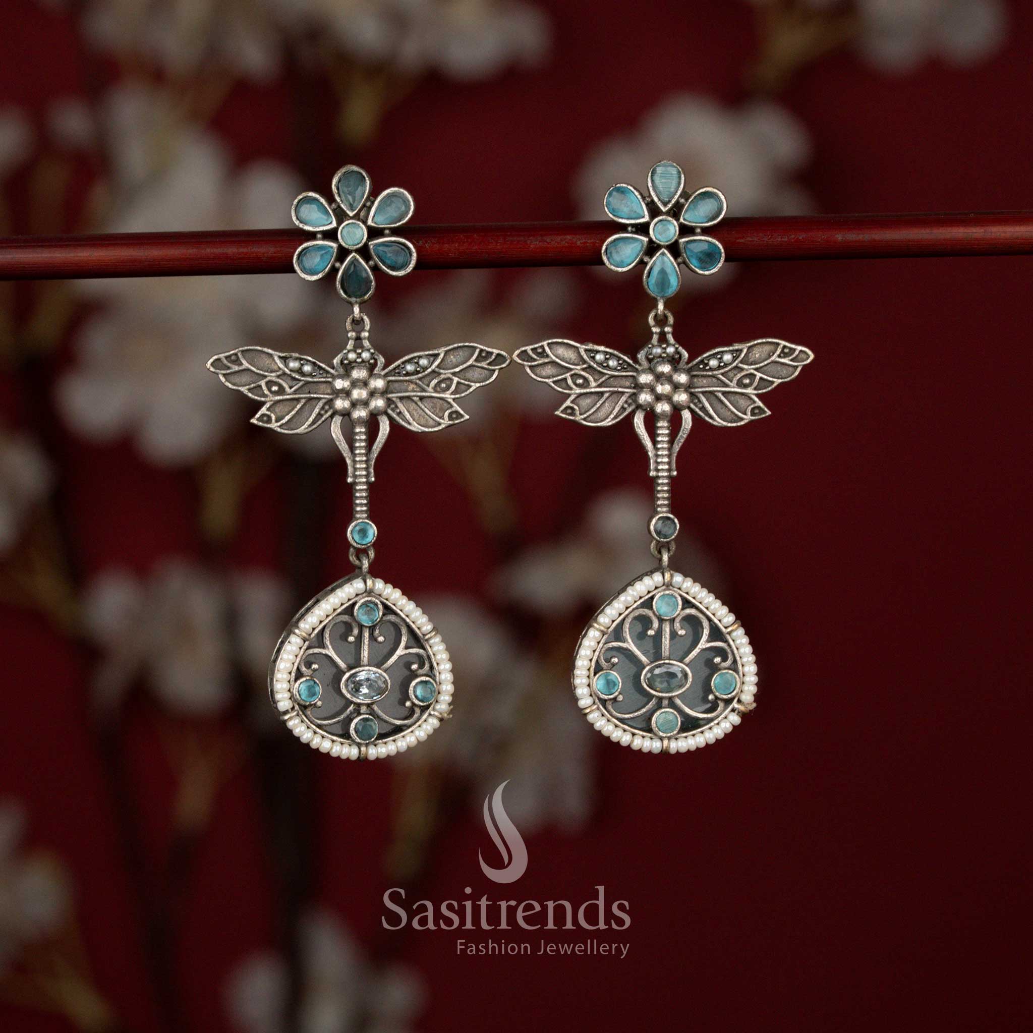 Beautiful Antique Oxidised 6-Petal Floral Dragonfly Wings Teardrop Earrings with Pearl Accents for Navarathri Wear - Sasitrends