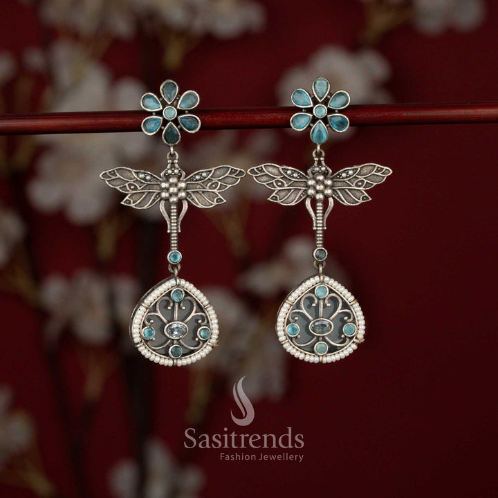 Beautiful Antique Oxidised 6-Petal Floral Dragonfly Wings Teardrop Earrings with Pearl Accents for Navarathri Wear - Sasitrends
